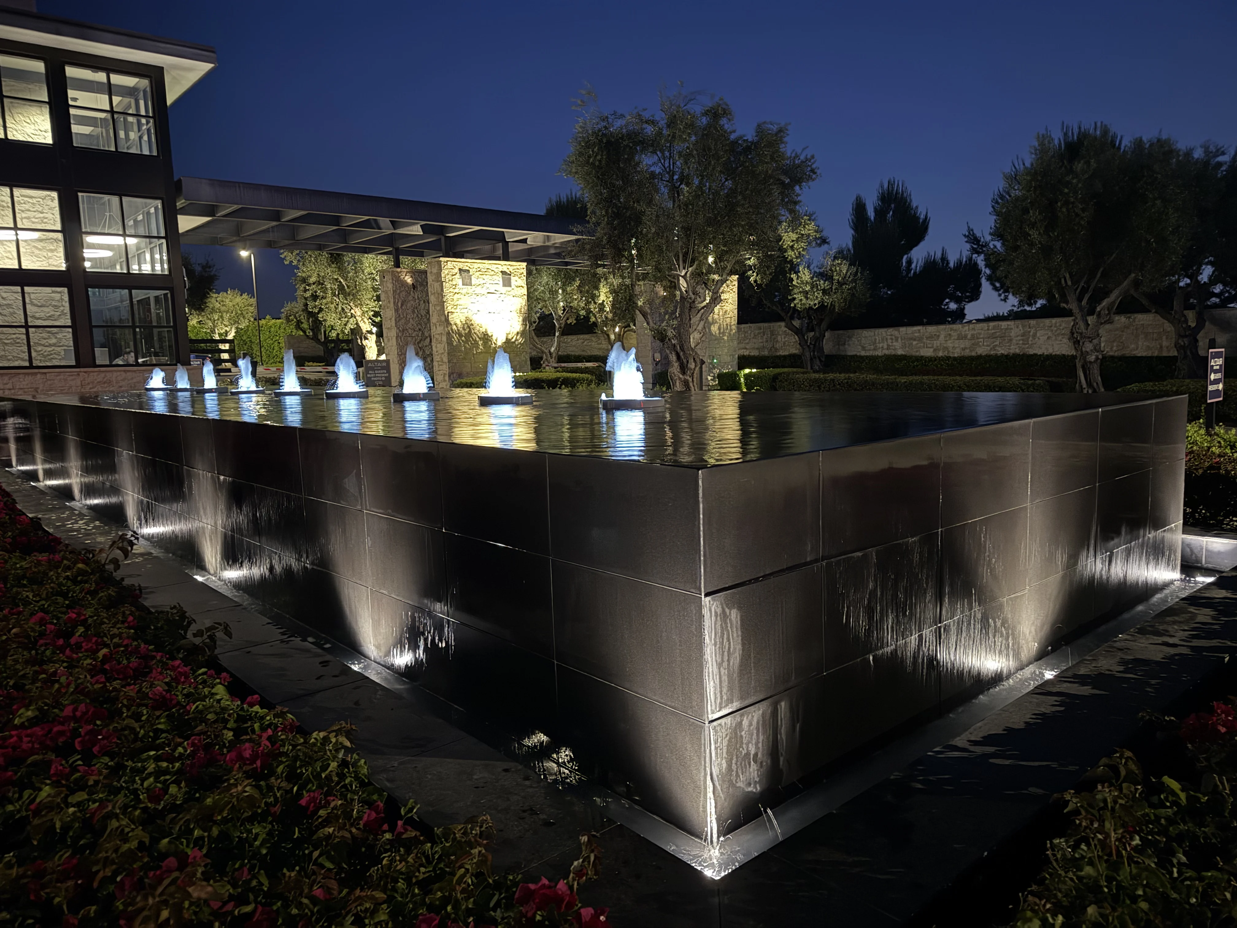 Commercial water feature with architectural uplighting at Altair office park